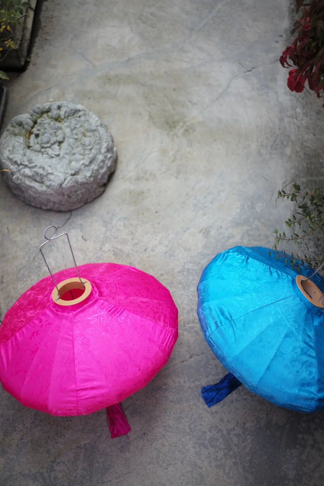 Pink and blue Oasis silk lanterns photographed from above